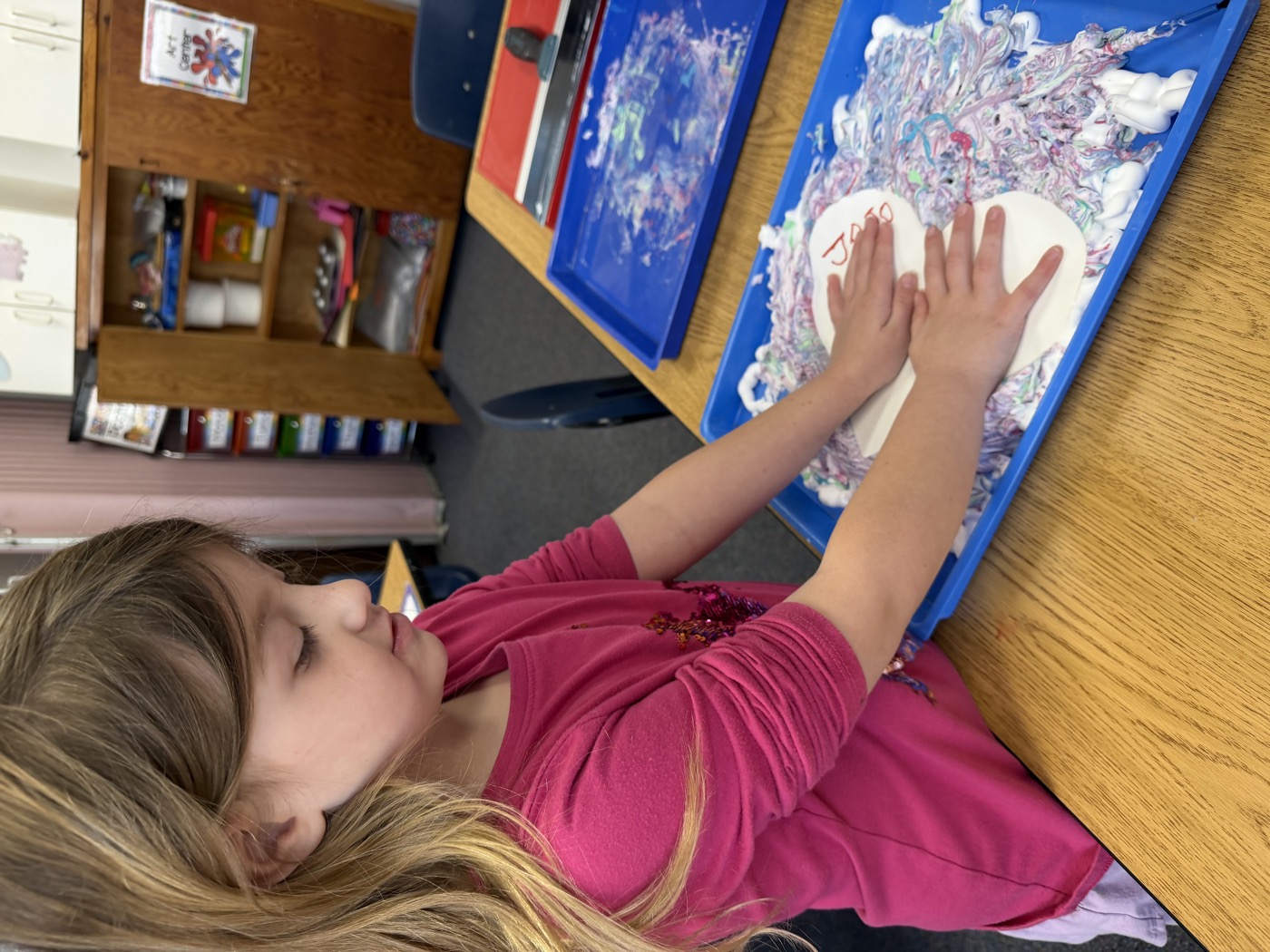 Child focused on an art project at Mt. Horeb Preschool