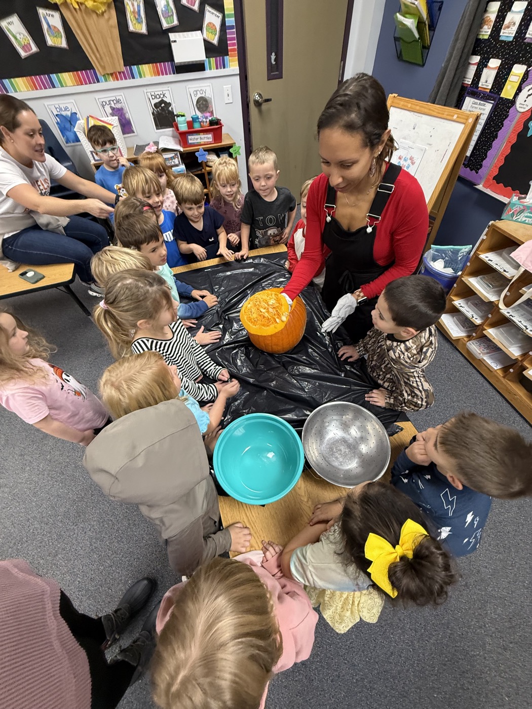 Kids doing a pumpkin activity